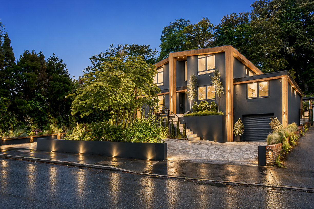 Luxury property exterior photographed at twilight